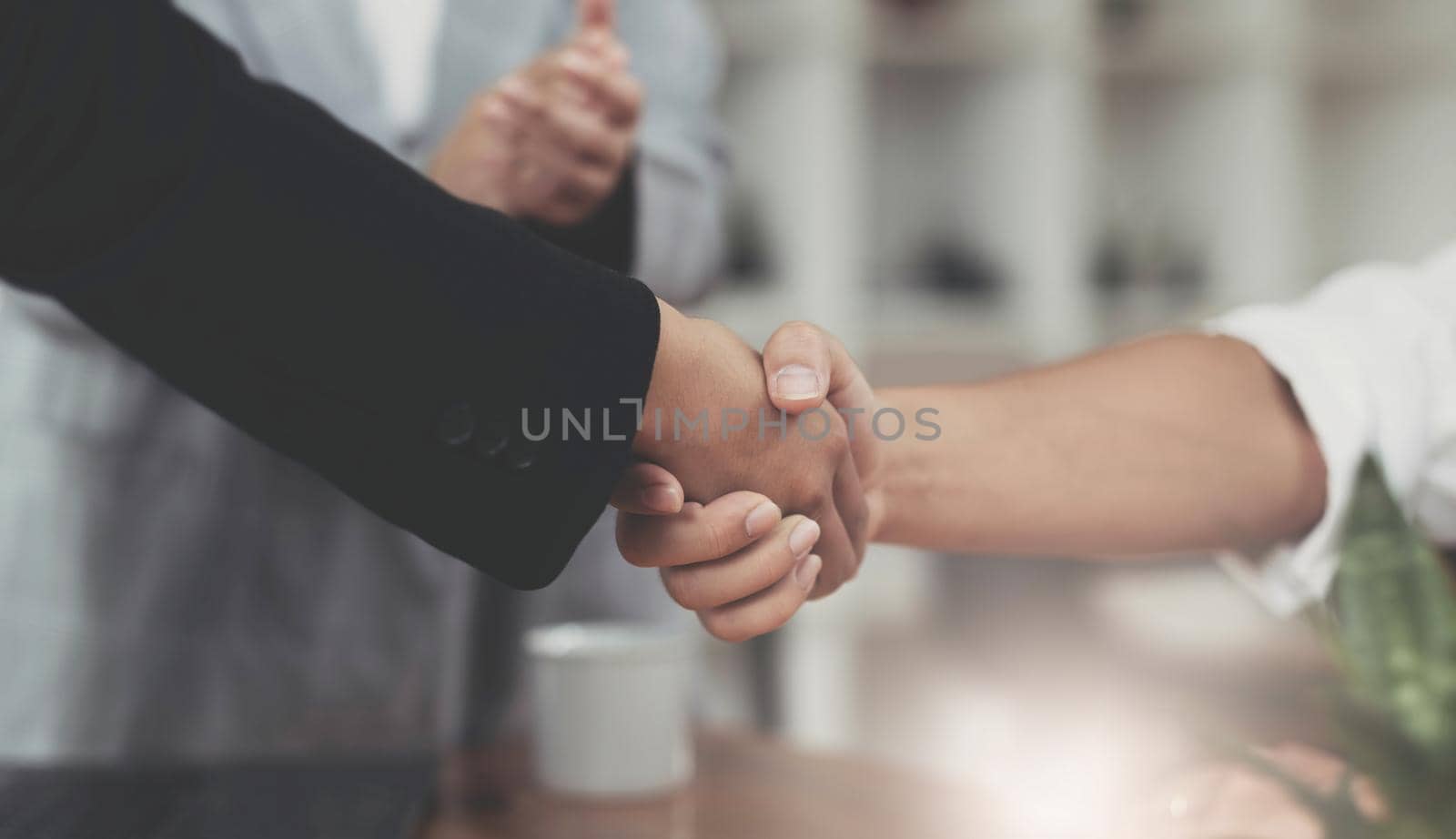 Image of Successful businessmen partnership handshaking after acquisition. Meeting for sign contracts and Group support concept. by wichayada