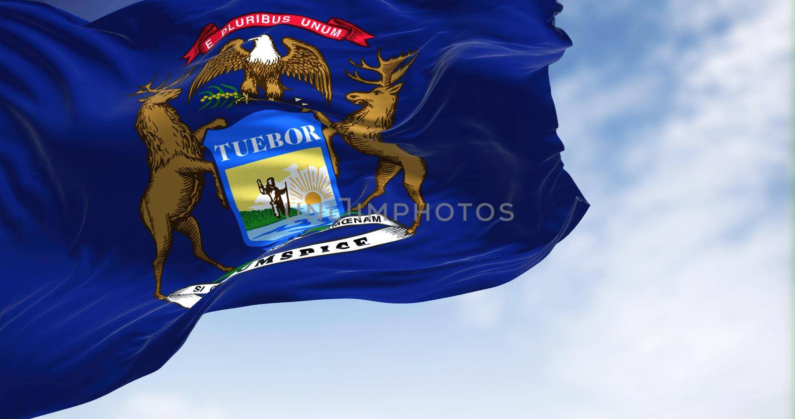 The US state flag of Michigan waving in the wind. MIchigan is a state in the Great Lakes region of the upper Midwestern United States. Democracy and independence.