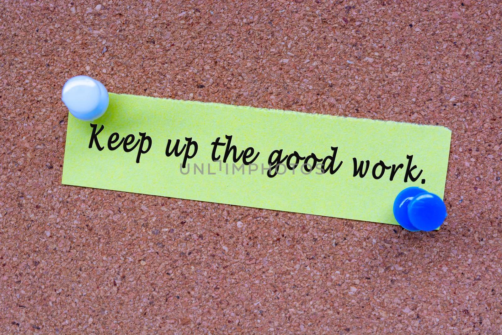 Keep up he good work words on stick note and pinned to a cork notice board. Encouragement words.