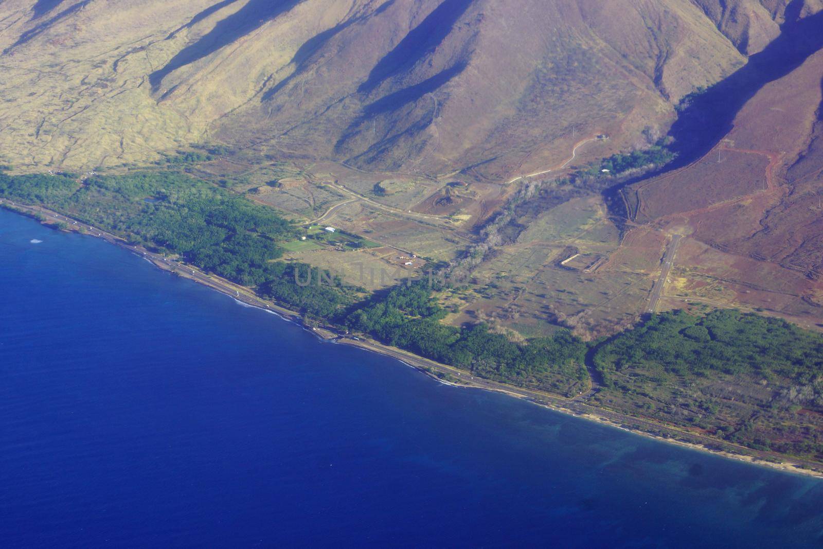 Aerial of Ukumehame Gulch, Maui, Hawaii.  Ukumehame Gulch is located south of Lahaina in west Maui. The upper reaches of Ukumehame Gulch flow from the wet interior of the West Maui Mountains through deep valleys that cut through a dense volcanic dike system.