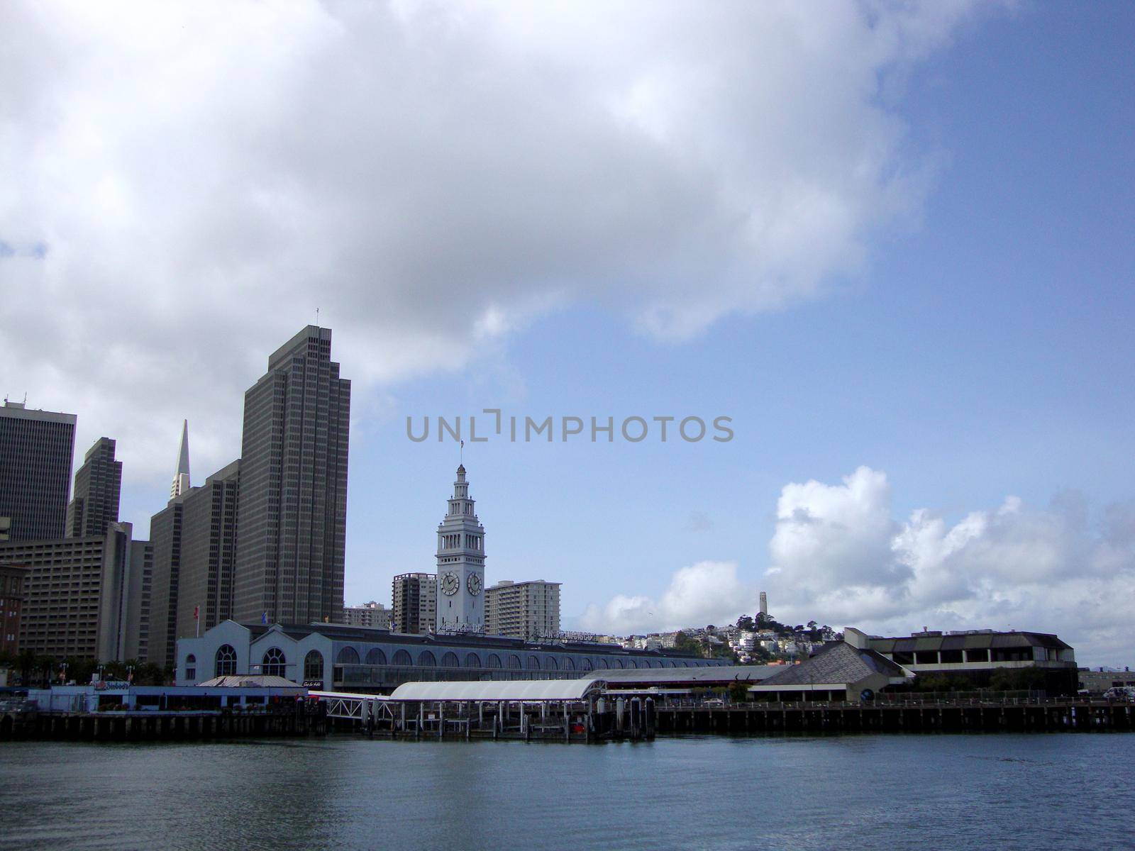San Francisco -  March 25, 2010: Port of San Francisco Ferry building, Coit Tower, cityscape of Downtown San Francisco on a clear day with birds in the air.  California.