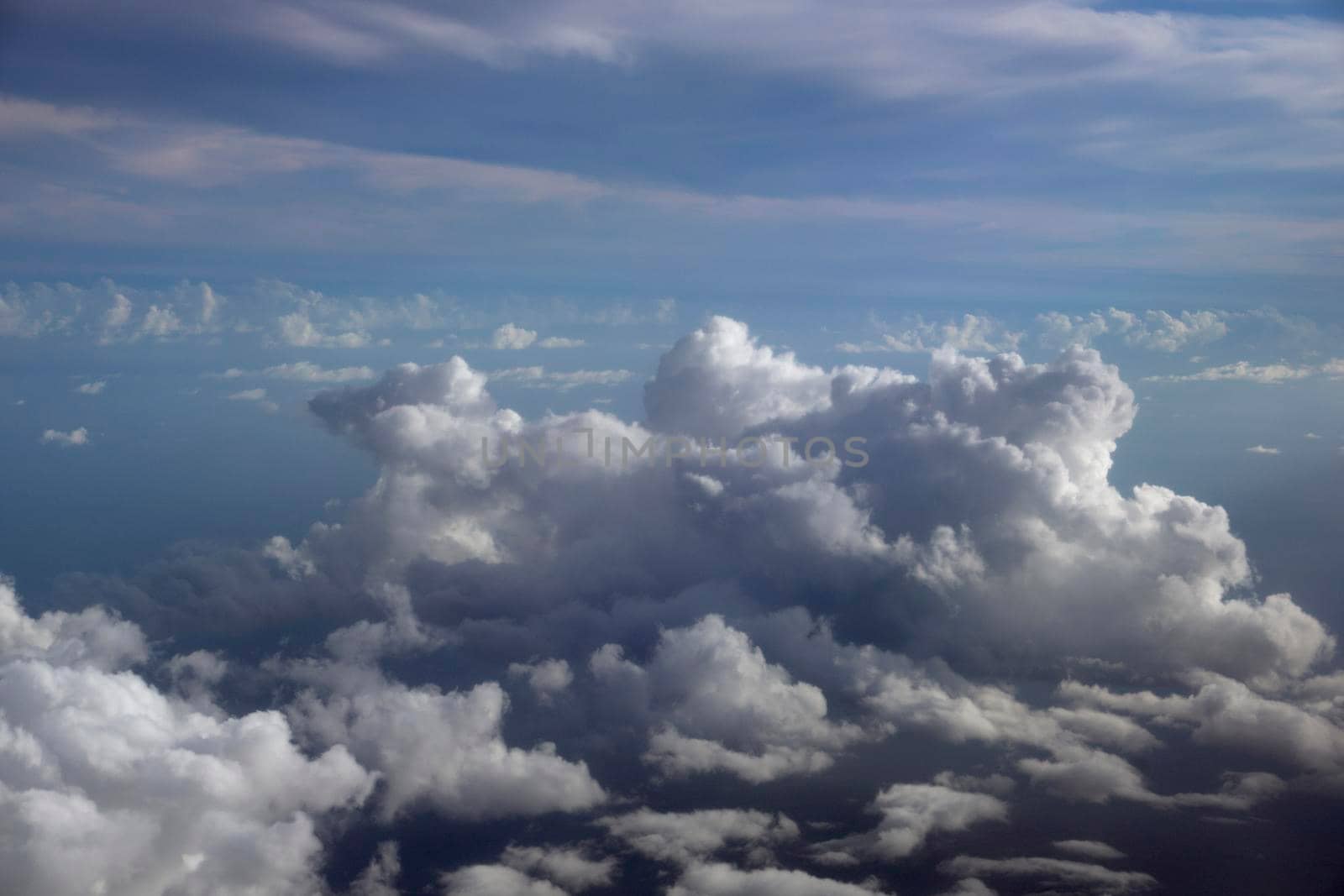 Fluffy Clouds in a blue sky above the ocean by EricGBVD