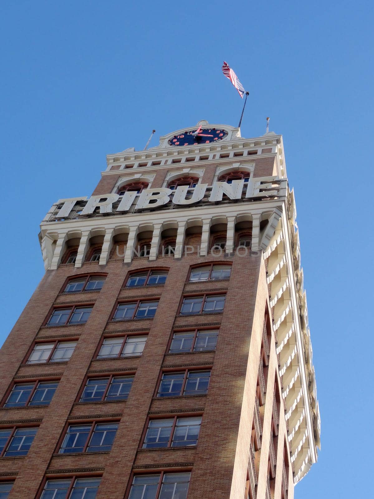 Oakland Tribune Clock Tower with USA Flag by EricGBVD