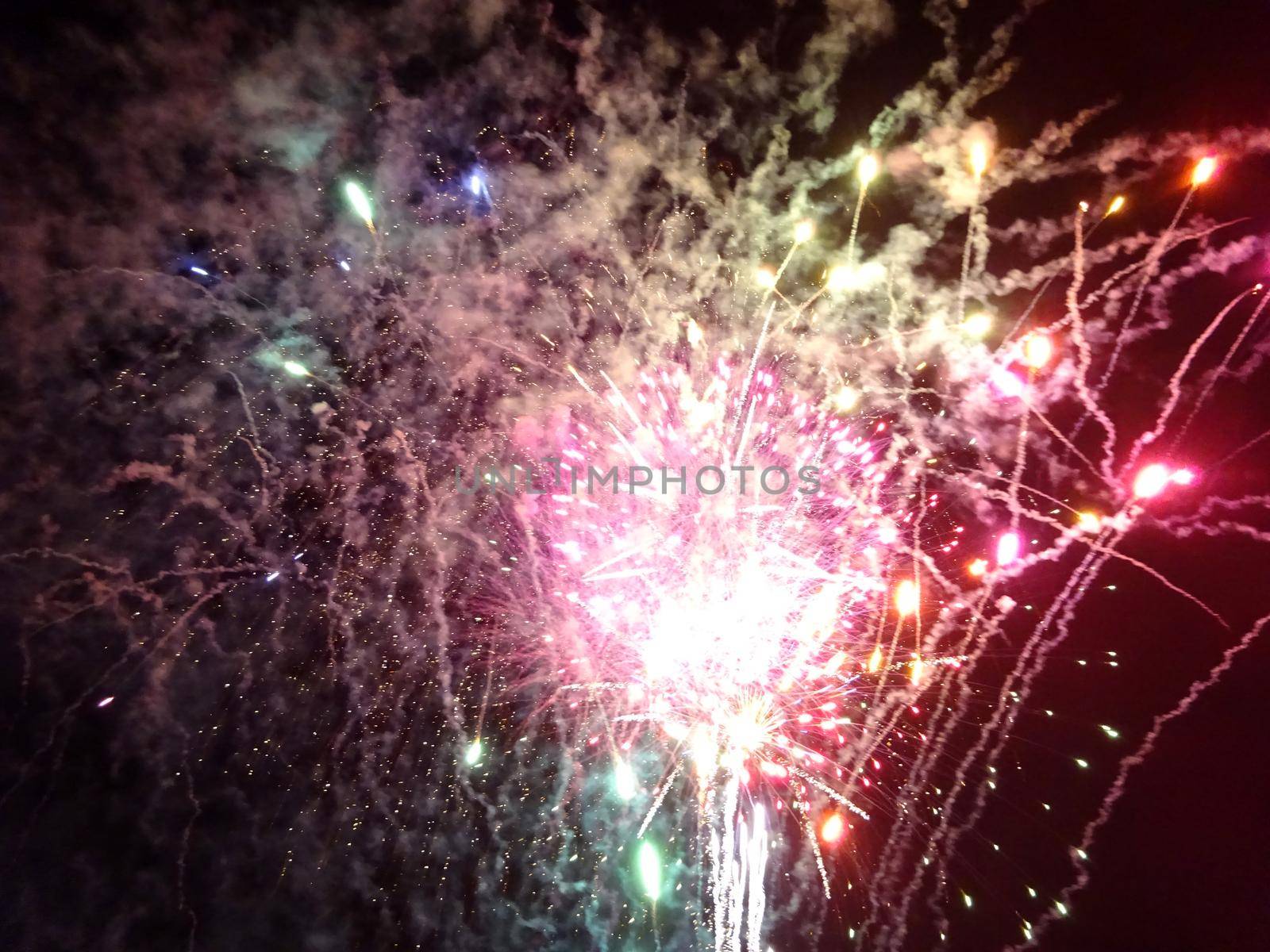 New Years Fireworks burst in the air at Outdoor New Years Party December 31, 2014 in Honolulu, Hawaii.