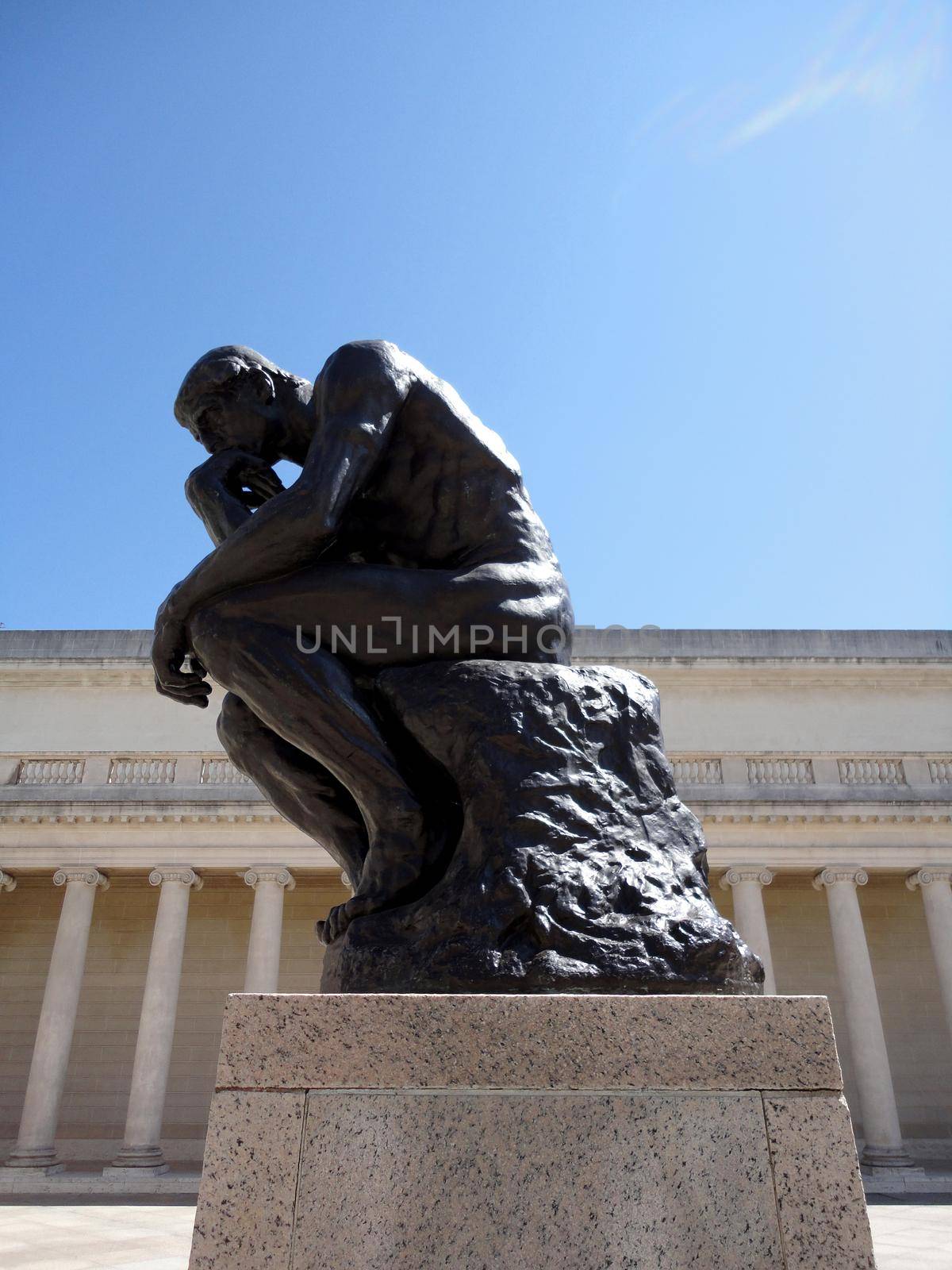 San Francisco - April 8, 2011:  Side profile of the masterpiece the Thinker by Rodin - The Thinker at the entrance of the Palace of the Legion of Honor in San Francisco.      