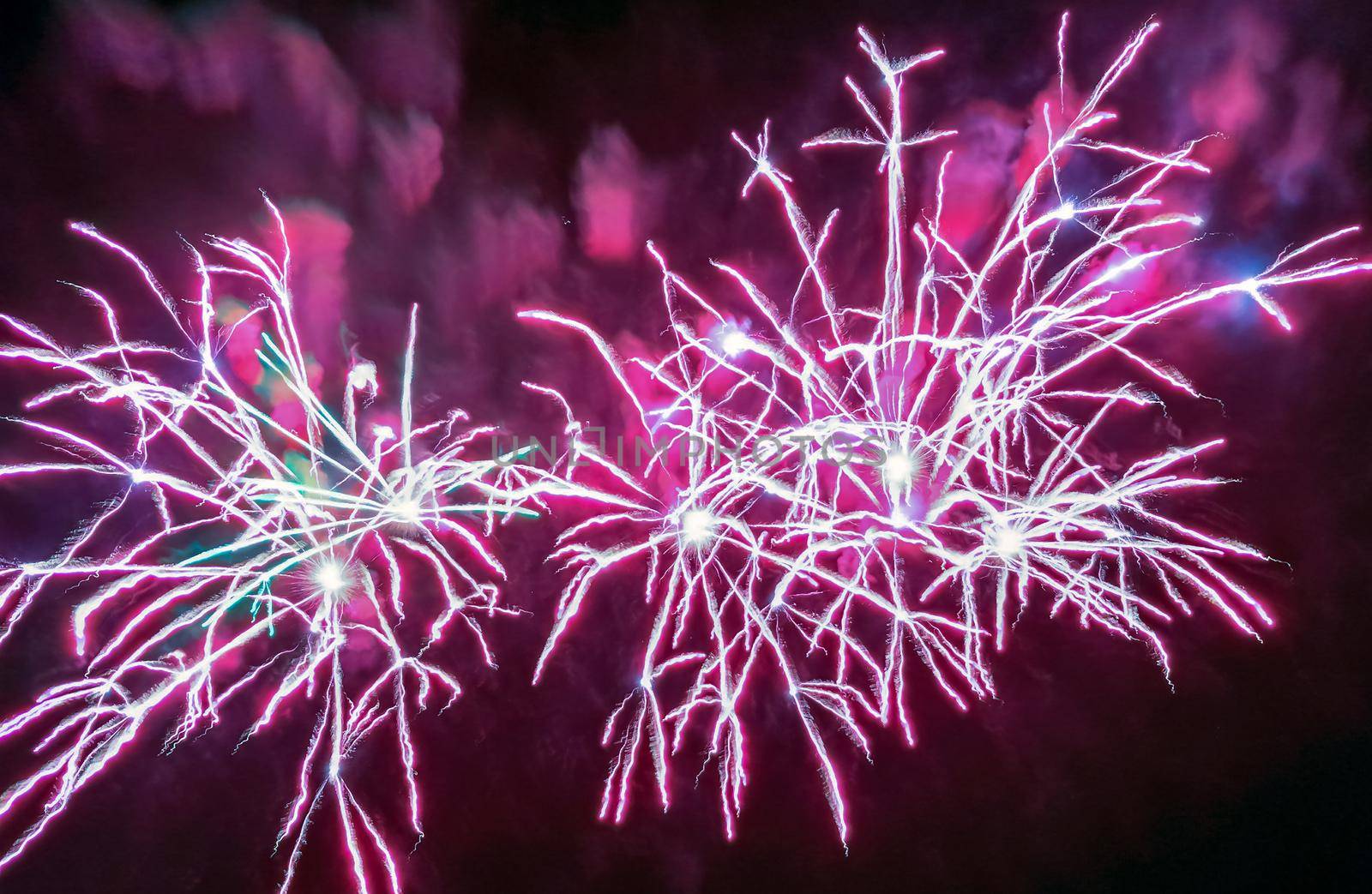 Colorful fireworks of various colors over night sky