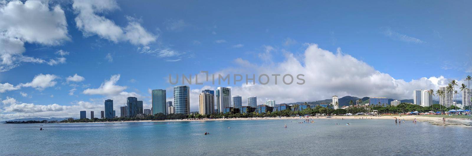 Honolulu - September 30, 2018:  Ala Moana Beach Park with office building and condos in the background during a beautiful day on the island of Oahu, Hawaii. 