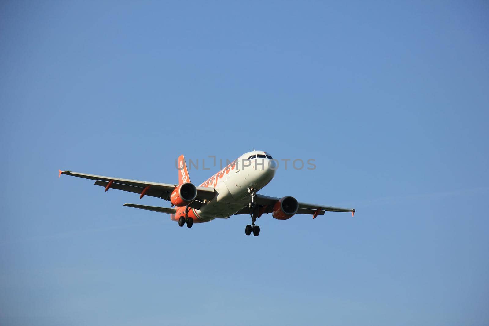 Amsterdam the Netherlands - May, 6th 2016: G-EZIW easyJet Airbus A319 approaching Schiphol Zwanenburg runway 18C, arriving from Toulouse, France