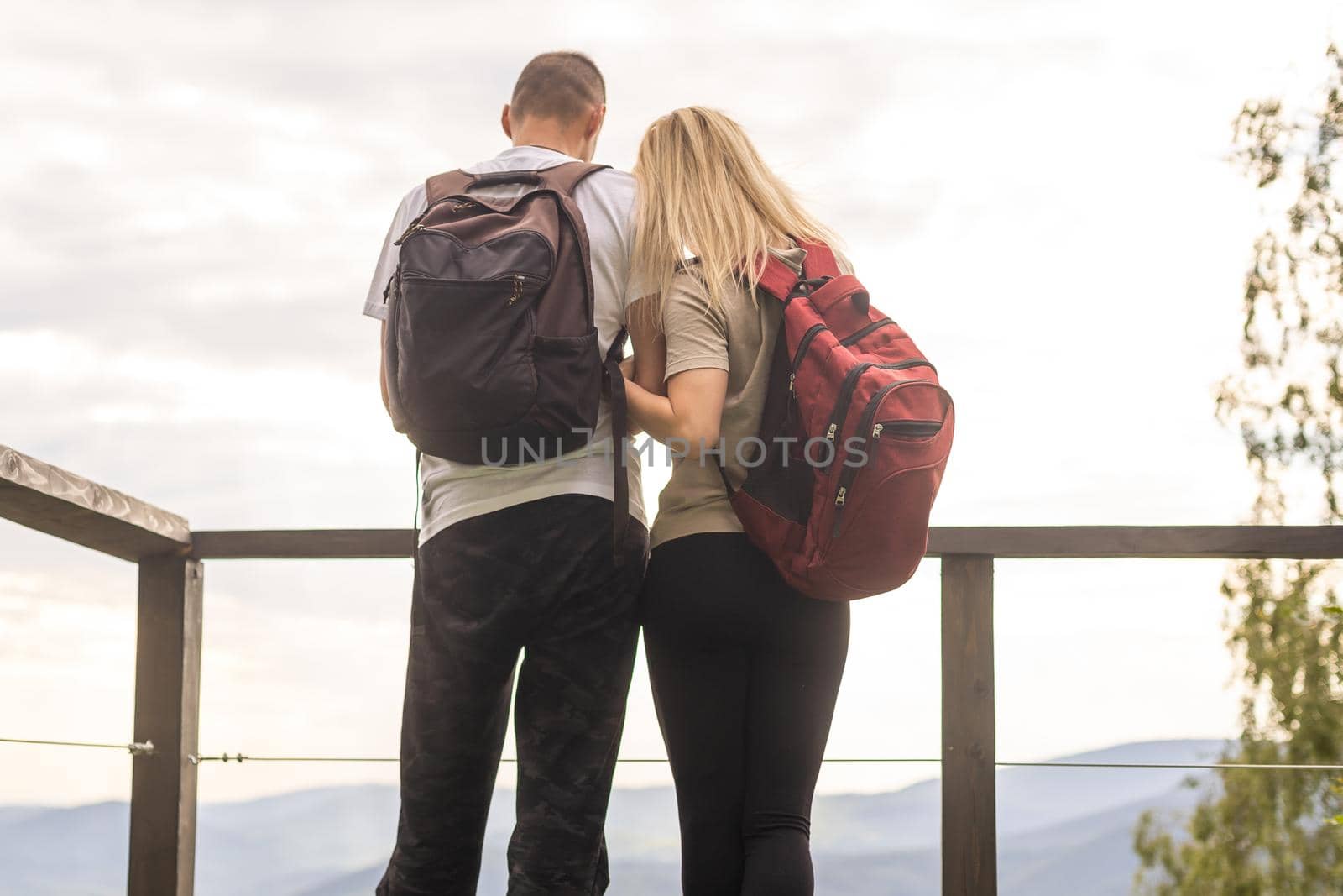 Happy couple at outdoor terrace in the mountains. Romantic time together by Andelov13