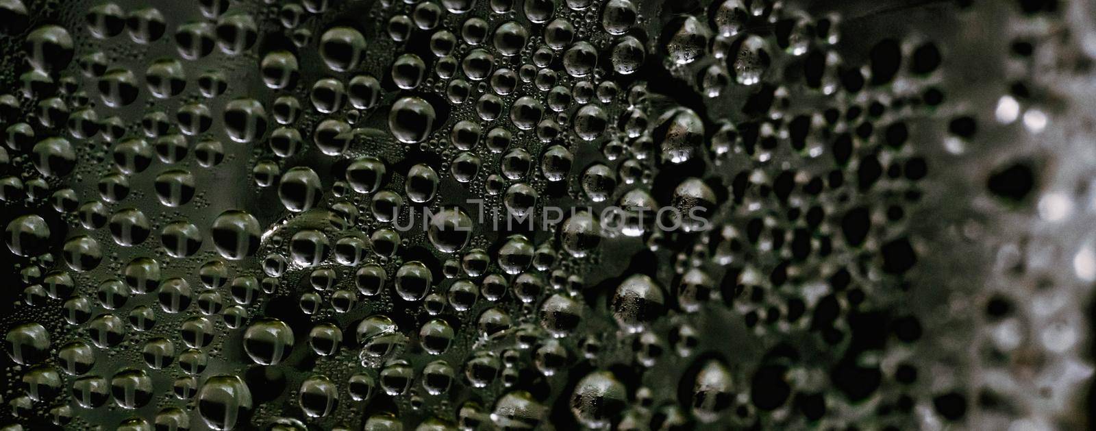 Many Water Rain Drops wet window condensation on glass. Fresh background. Textures formed by bubbles. Collection clear surface. Abstract real photo beautiful romantic cute wallpaper. Dark green brown.