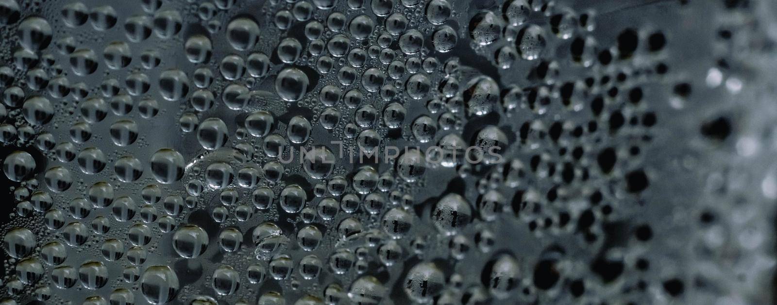 Many Water Rain Drops wet window condensation on glass. Fresh background. Textures formed by bubbles. Collection clear surface. Abstract real photo beautiful romantic cute wallpaper. Dark green gray.