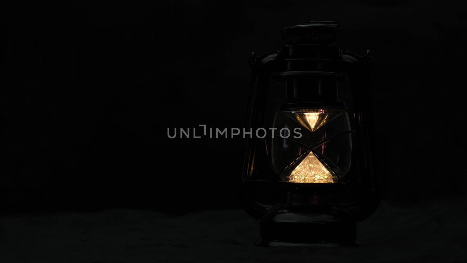 Vintage lamp on the table in the room. Retro lamp at night.