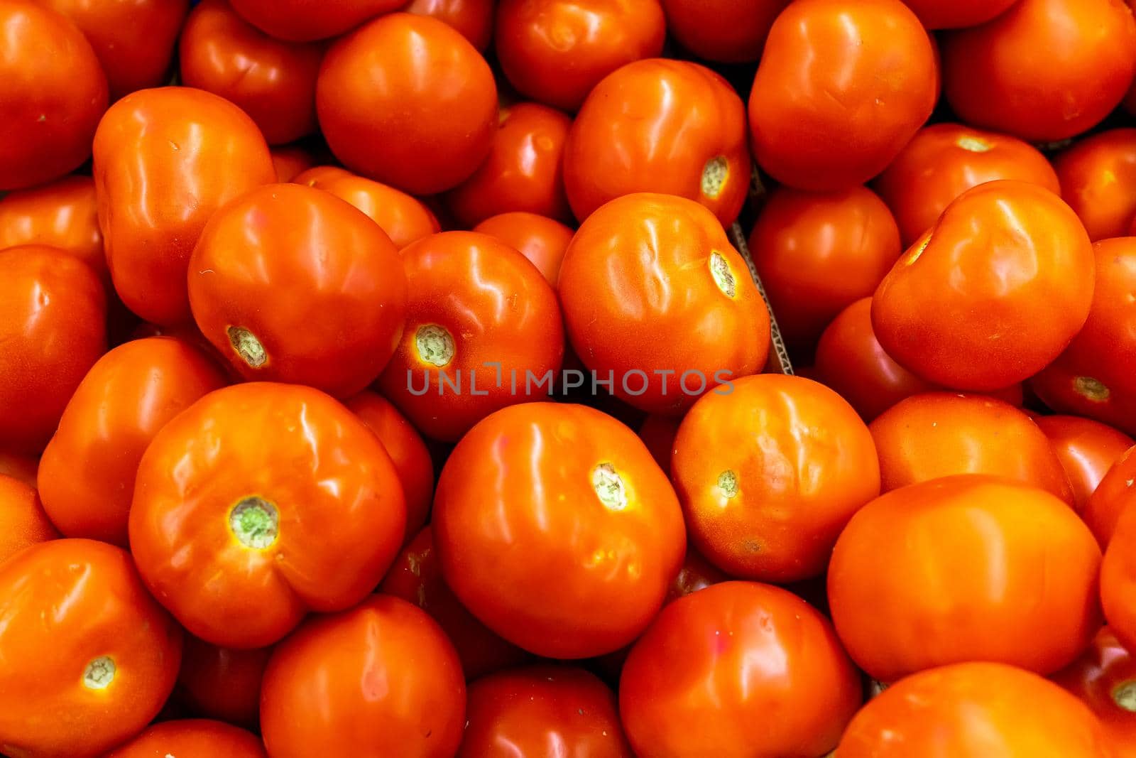 Close up of many fresh red tomatoes big fruit type by Serhii_Voroshchuk