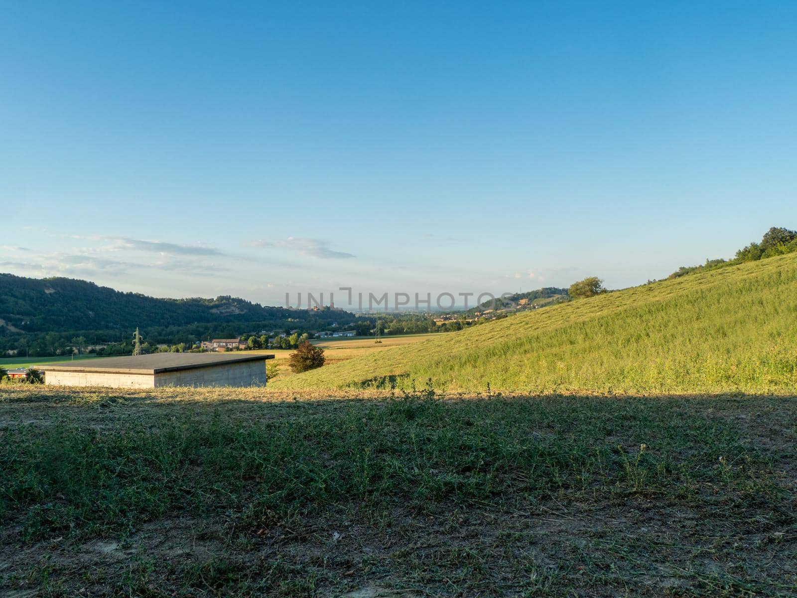 Woman watering and washing on a public foutain in Castell'Arquato Italy.Pure and precious to nature. Shot of hands held out to catch a stream of water outside.