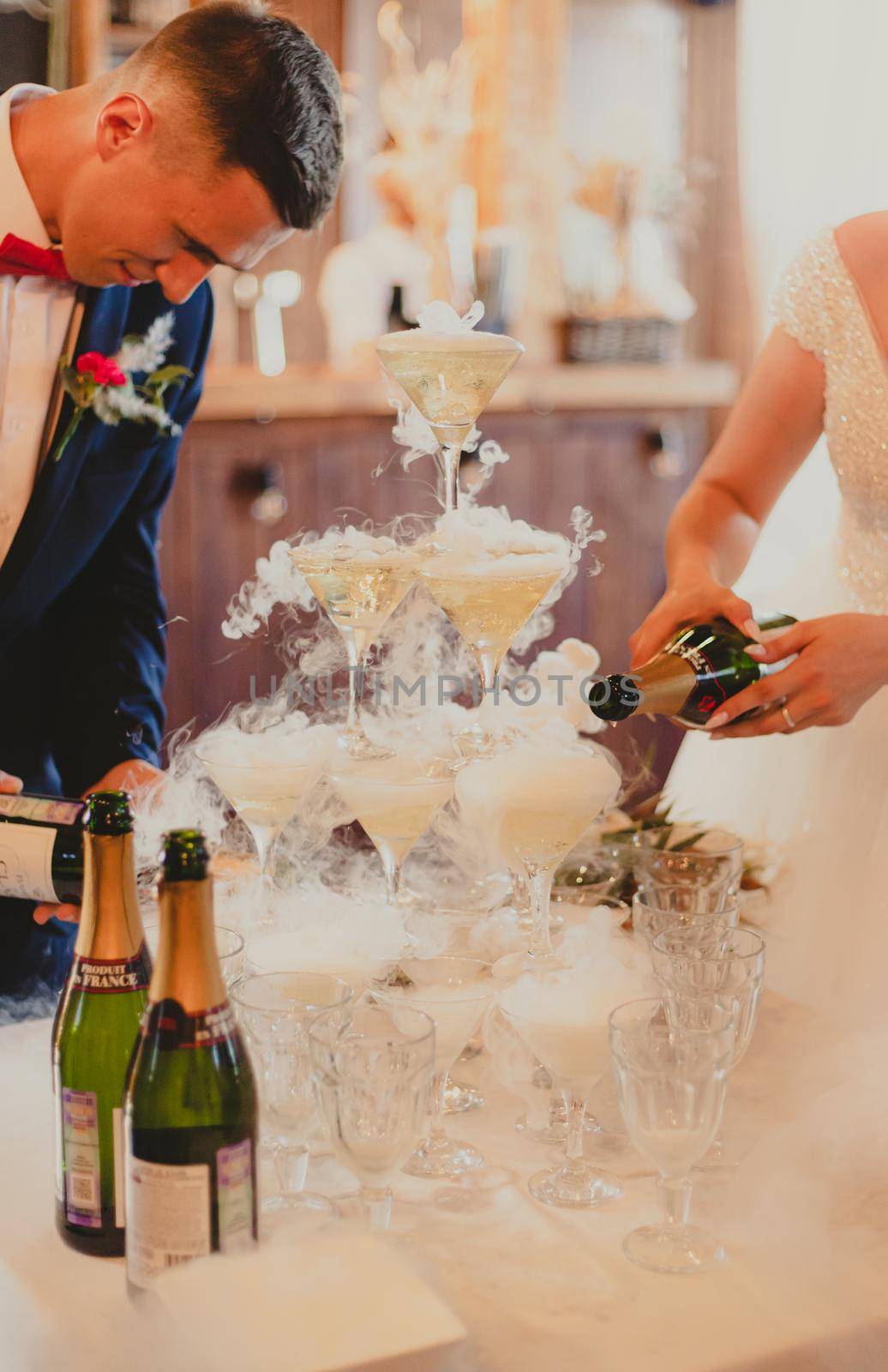 The bride and groom fill the champagne fountain. Wedding article. A happy couple. Love. Photos for printed products. Romance. by alenka2194