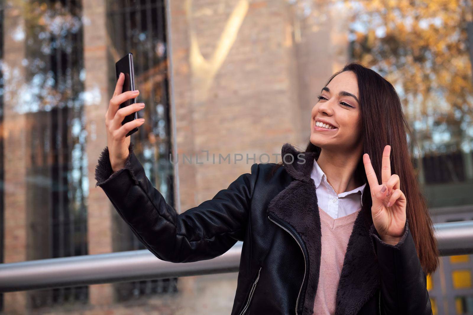 young woman taking a selfie with the phone, concept of technology and communication