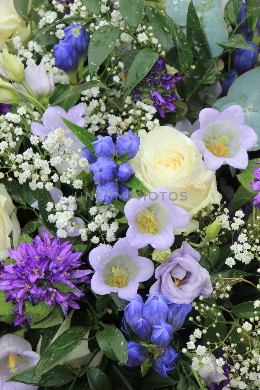 Blue white flower arrangement by studioportosabbia