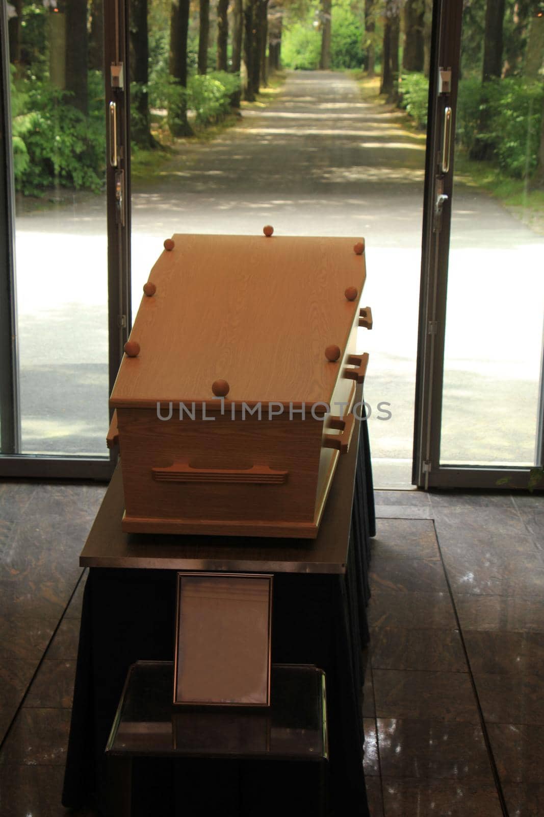 Plain light wooden coffin in a crematorium