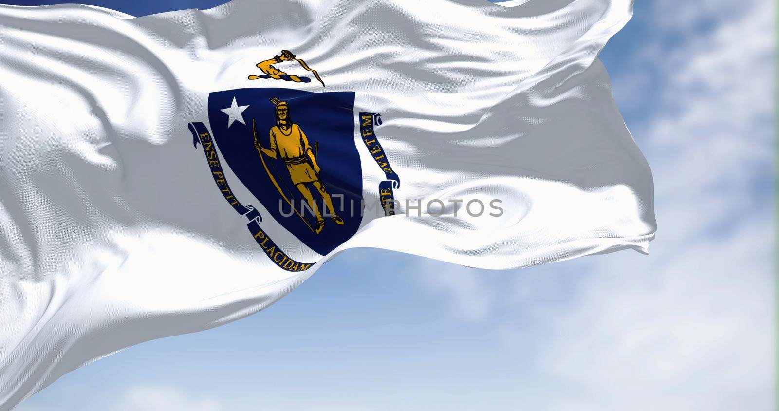 The US state flag of Massachusetts waving in the wind. Massachusetts is the most populous state in the New England region of the United States. Fabric texture background.