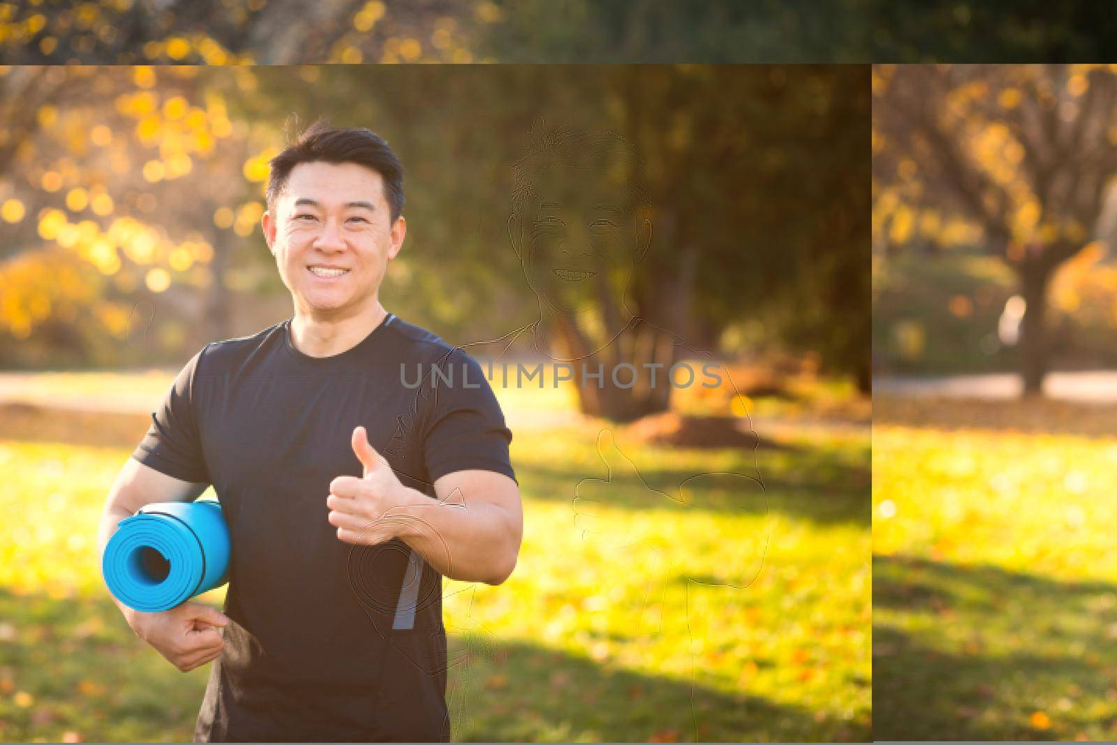 Active handsome male yogi walks in a park strolling forest before or after a workout. Young asian athletic man athlete goes to yoga class with a fitness mat in his hands. Outdoors Healthy lifestyle