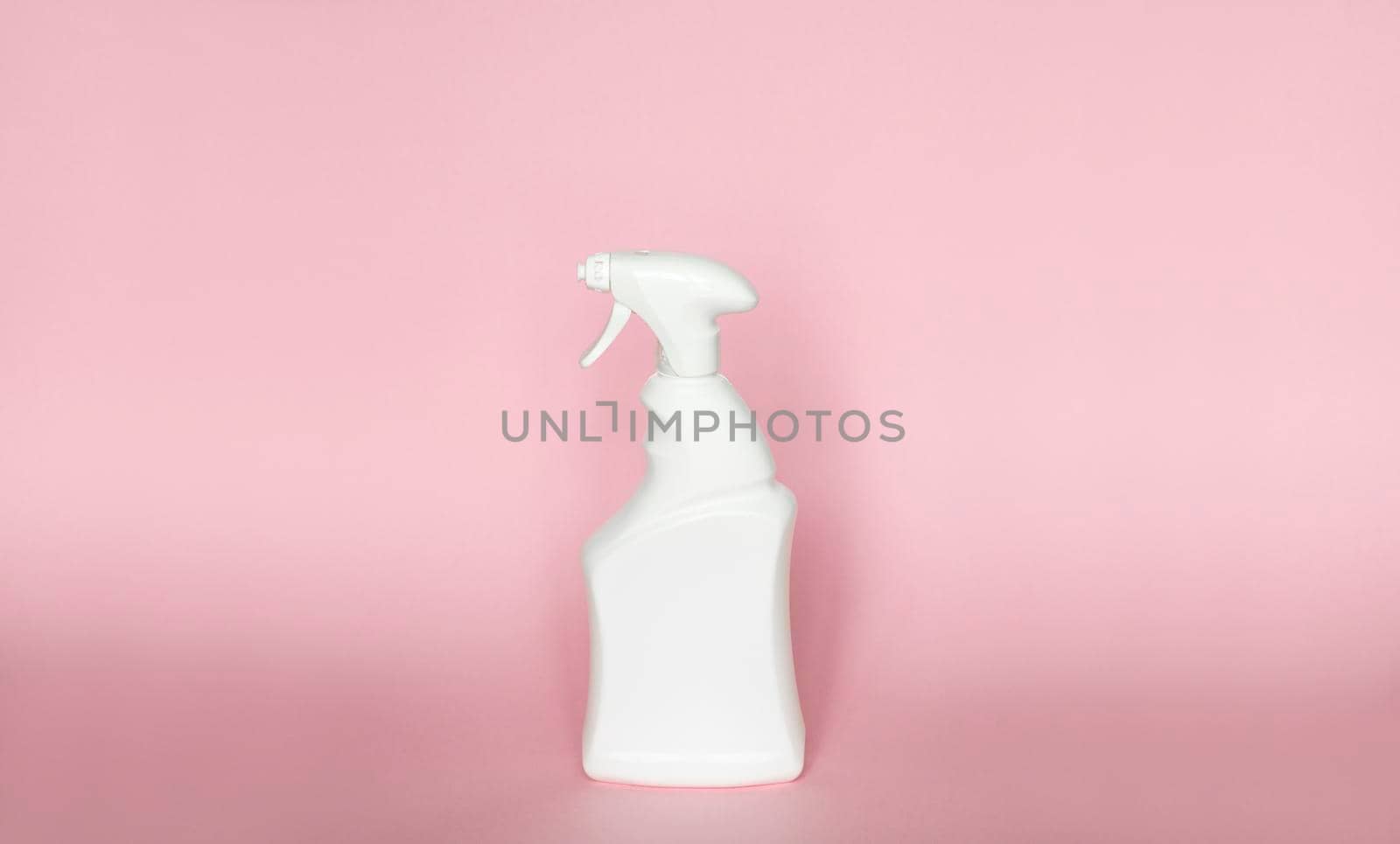 White blank plastic spray detergent bottle isolated on pink background. Packaging template mockup. by vovsht