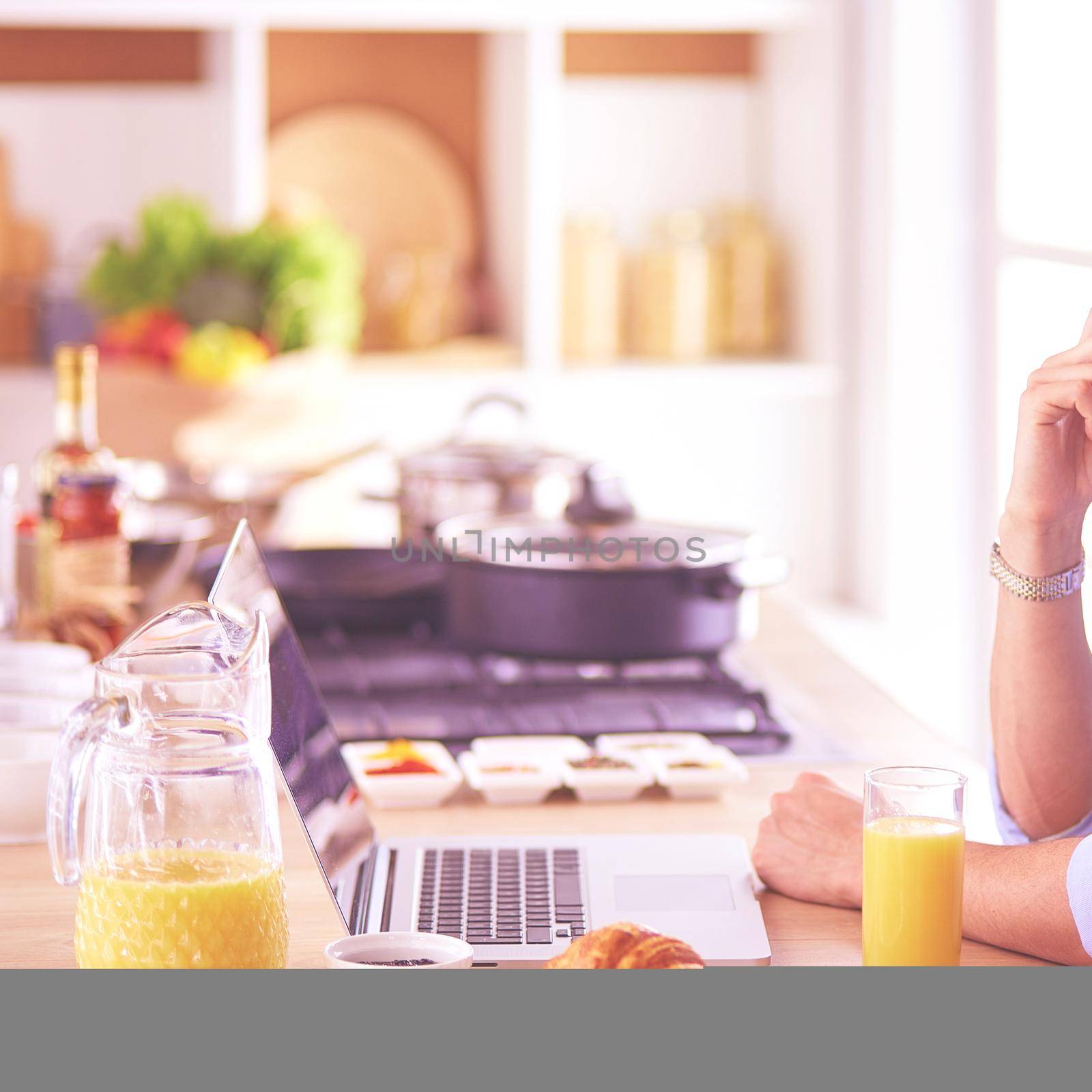 Man preparing delicious and healthy food in the home kitchen by lenets