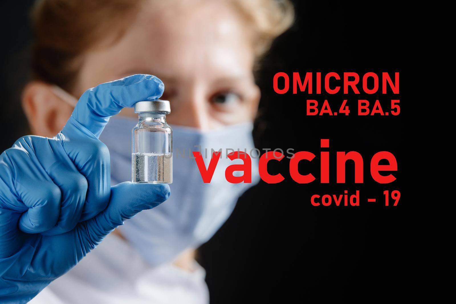 A female doctor wearing a protective mask holds a ba.5 and ba.4 omicron vaccine. Omicron BA.4 BA.5 . Covid 19 alpha, beta, gamma, delta, lambda, mu, omicron variants.