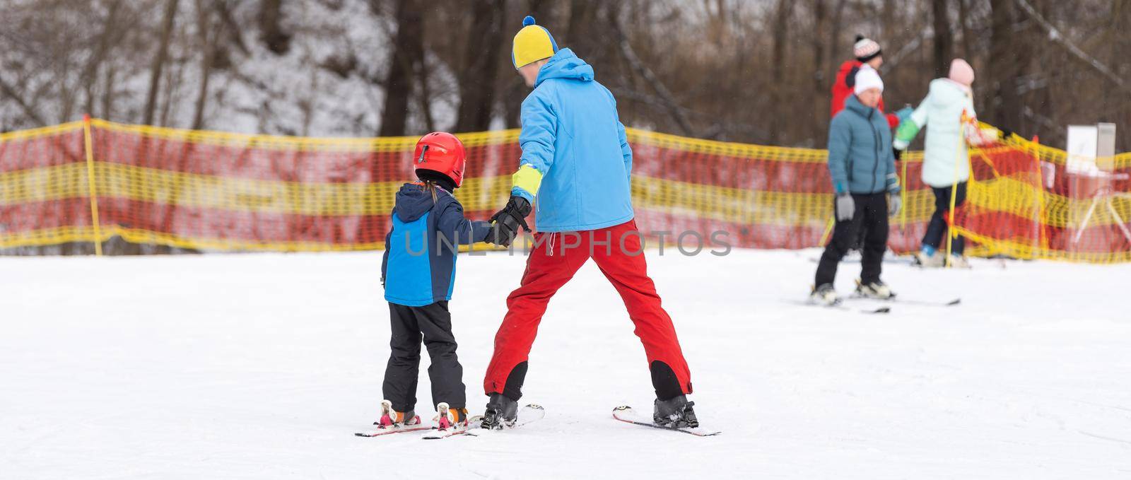 skiing master class for kids with instructor in winter sports school for children
