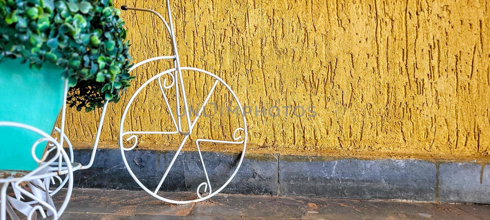 golden background with garden decoration with old bicycle by sarsa