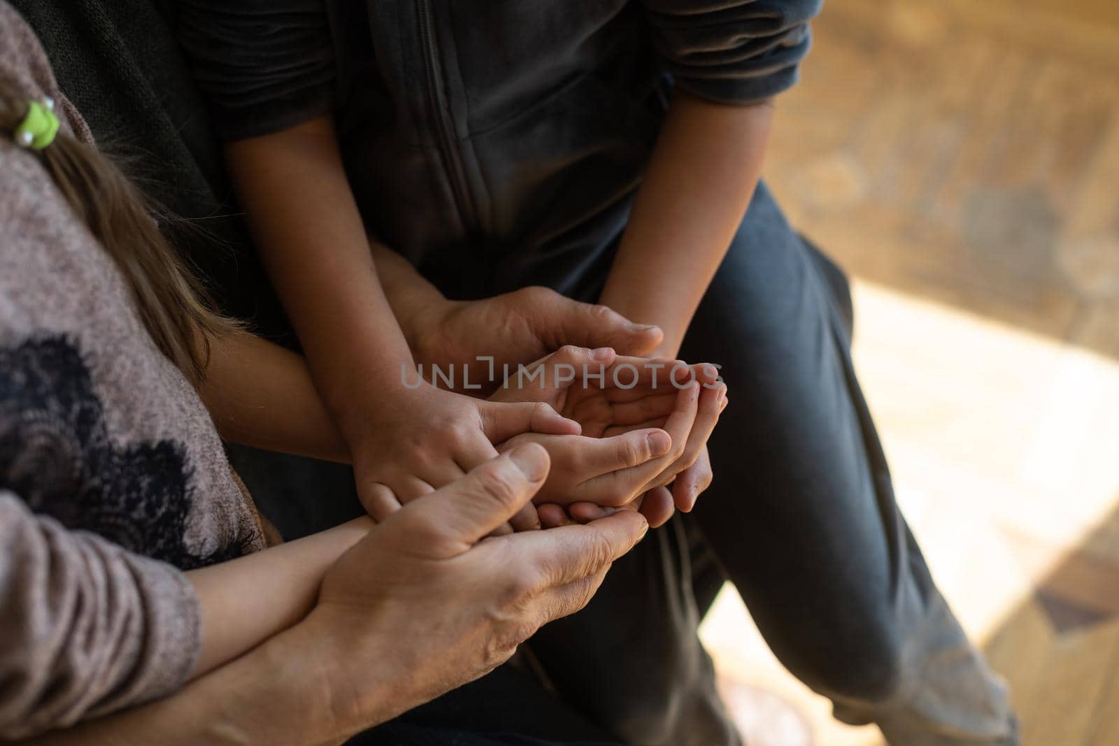 Family bonding. grandfather and child holding hands together, closeup view. Panorama.