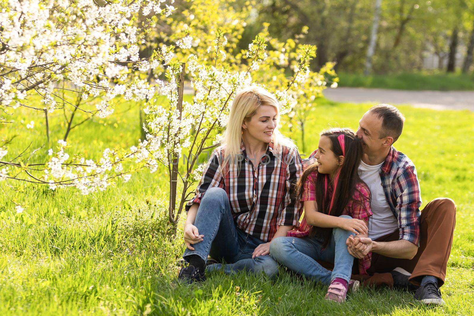 Young family with child having fun in nature.