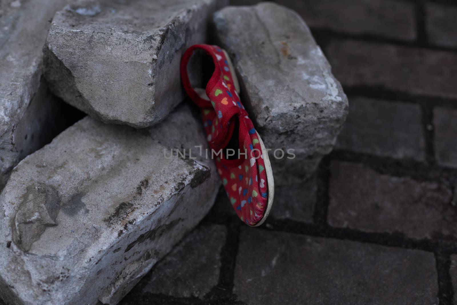 children's shoes in the ruins, the war.