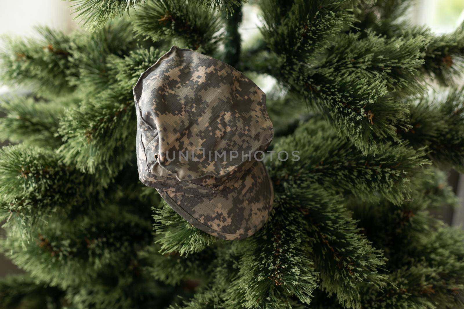Christmas in the army. ball and gift box, military uniform, closeup view.