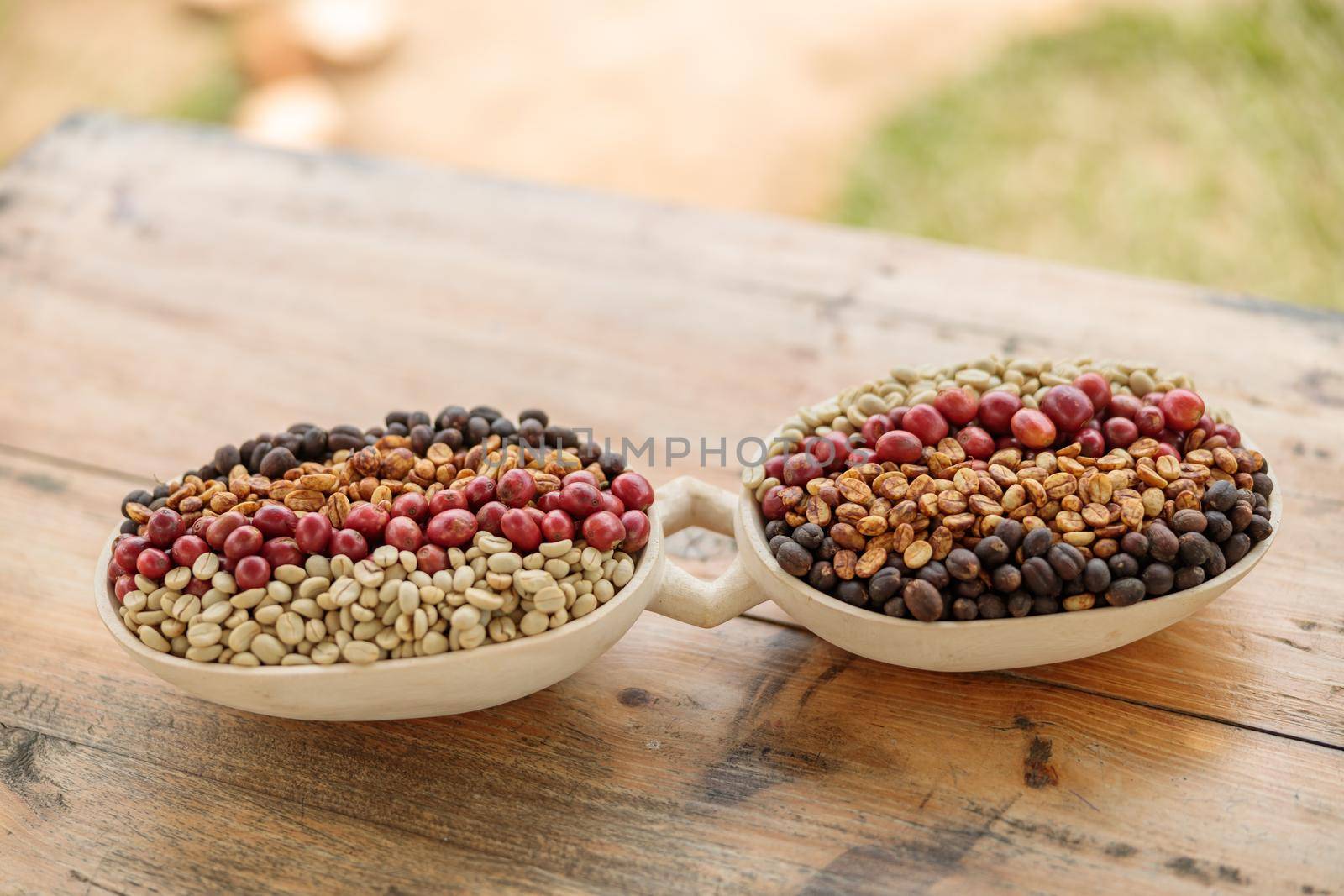 Coffee beans of different processing processes in a wooden bowl by Yaroslav_astakhov