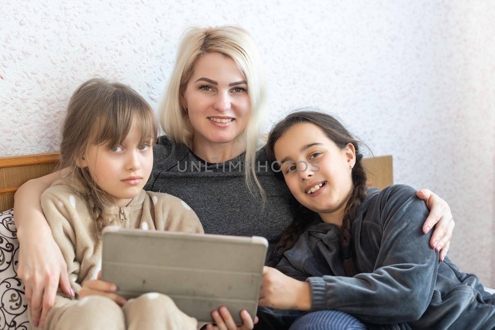 Mother and daughter looking at tablet.