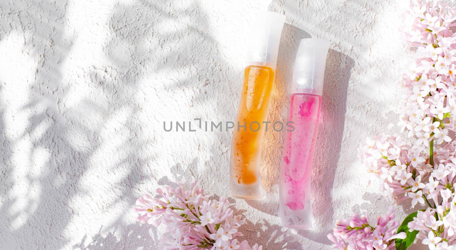 Perfume bottles with flowers . The choice of fragrance. Cosmetology. Cosmetic products. An article about perfume. Copy space.