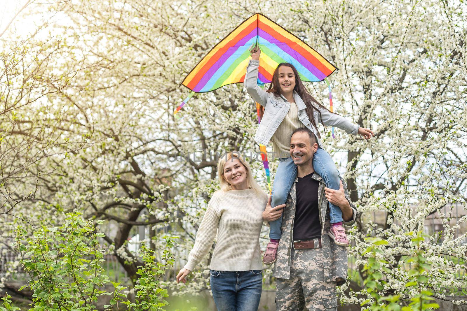 happy military family relaxing in the garden.