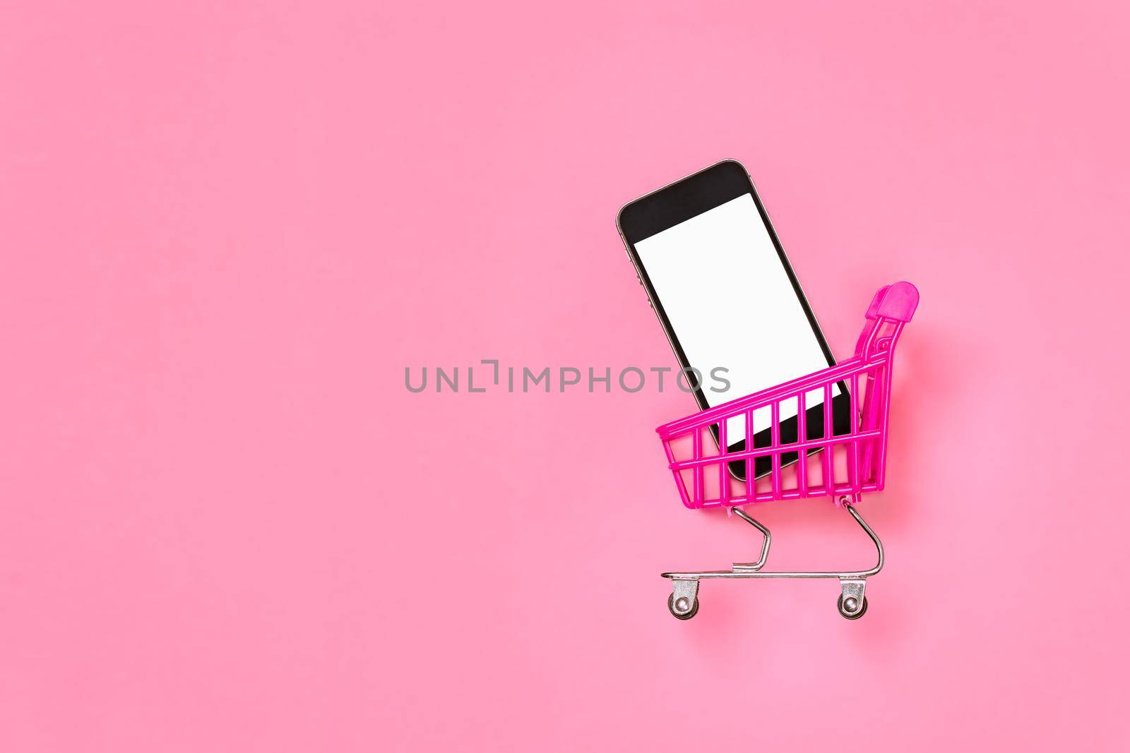 Digital shopping pink concept sales mobile online shopping trolley isolated screen smartphone mockup. E store online supermarket cart with phone mockup mobile shopping cart isolated on pink background by synel