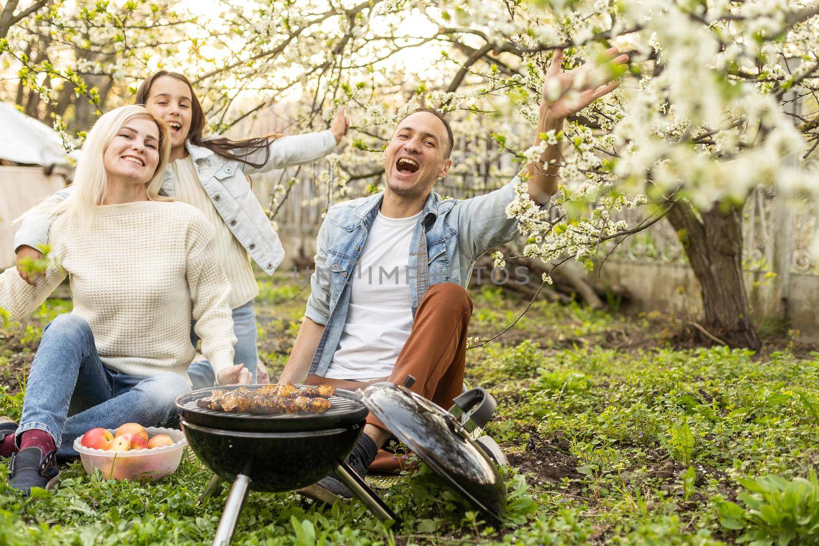 Happy family on summer picnic in park