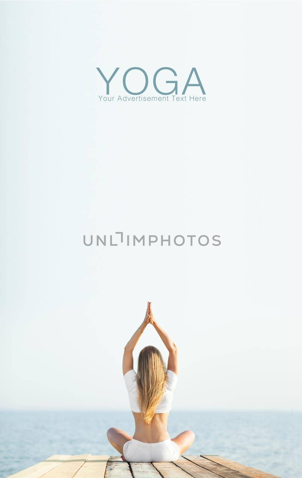 Beautiful blond woman practicing yoga at seashore and meditating by MikeOrlov