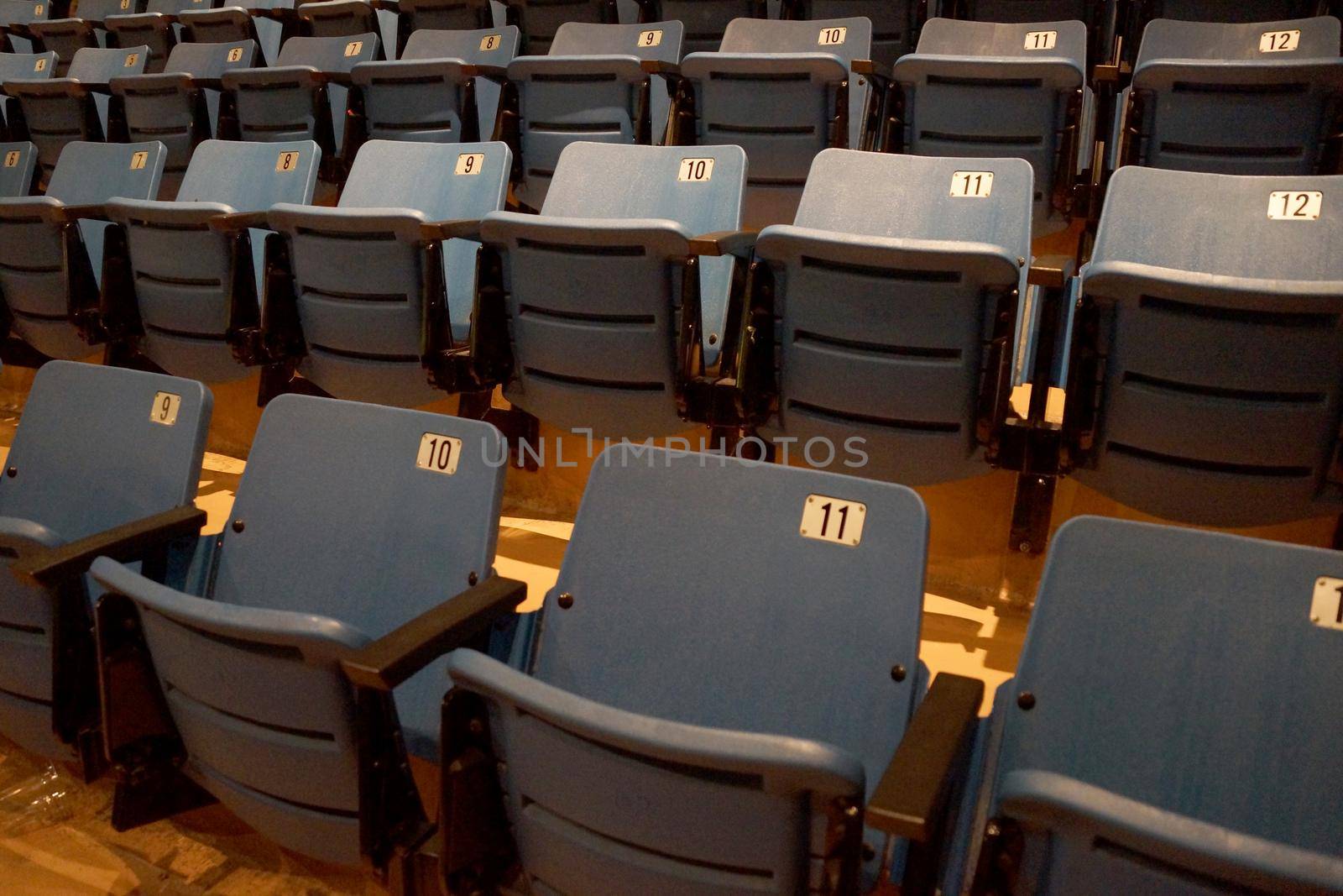Light Blue Seat with armrests at the San Jose Event Center in San Jose, California.  Numbered Seats 5, 6, 7, 8, 9, 10, 11, 12 visible.