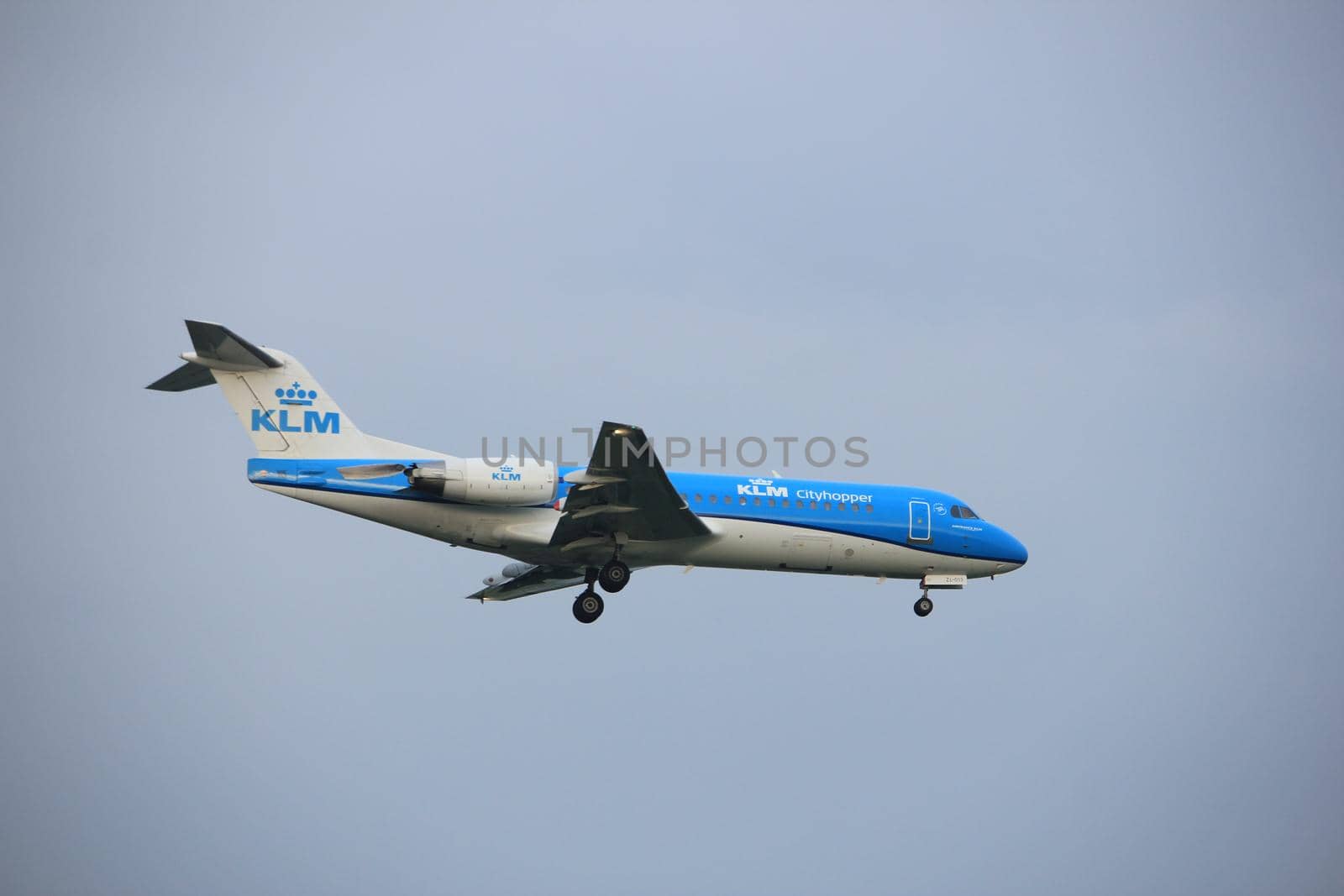 Amsterdam, the Netherlands - June 22nd 2017:PH-KZL KLM Cityhopper Fokker F70 approaching Polderbaan runway at Schiphol Amsterdam Airport, the Netherlands