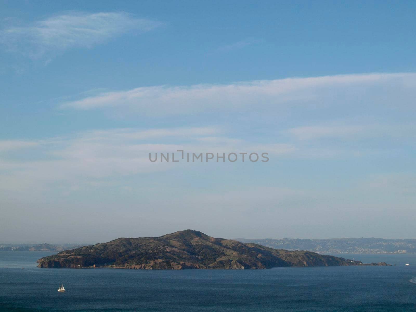 Angel Island in San Francisco Bay with sail boats in the water and Tiburon, Berkeley in the background in California 2010.  Taken from Golden Gate Bridge.