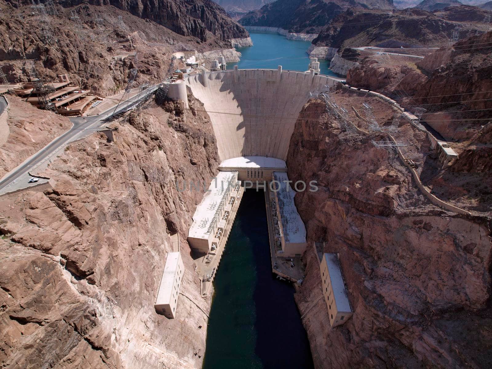 Aerial view of Hoover Dam, Lake Mead, and road leading to dam by EricGBVD