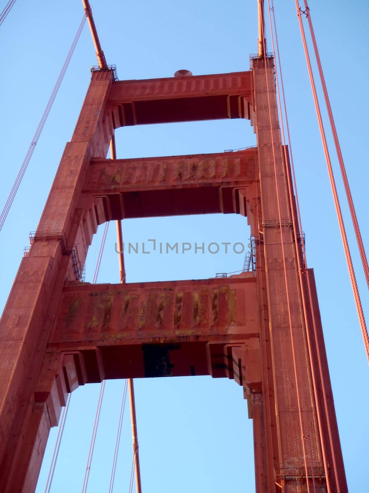 Upward perspective of Art Deco Tower and supporting cables on the Golden Gate Bridge.