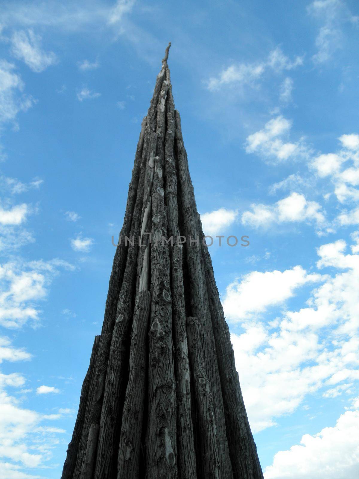 San Francisco, California - October 1, 2010:  Standing at 100 feet tall at its tapering peak, Spire is a sculpture by world-renowned artist Andy Goldsworthy.  in 2008 Goldsworthy selected 37 Monterey cypress trunks from trees felled at the site and meticulously fastened them together. 