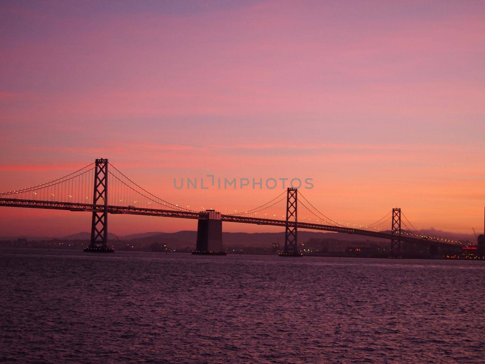 San Francisco side of Bay Bridge and downtown San Francisco at dusk by EricGBVD