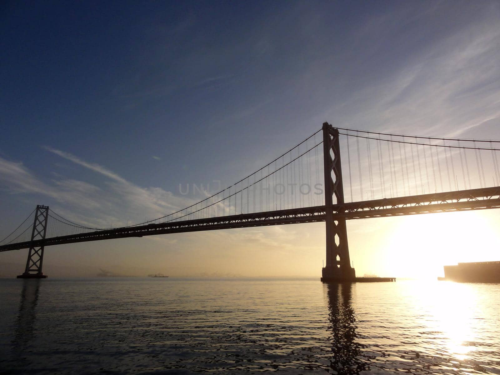 San Francisco side of Bay Bridge at sunrise by EricGBVD