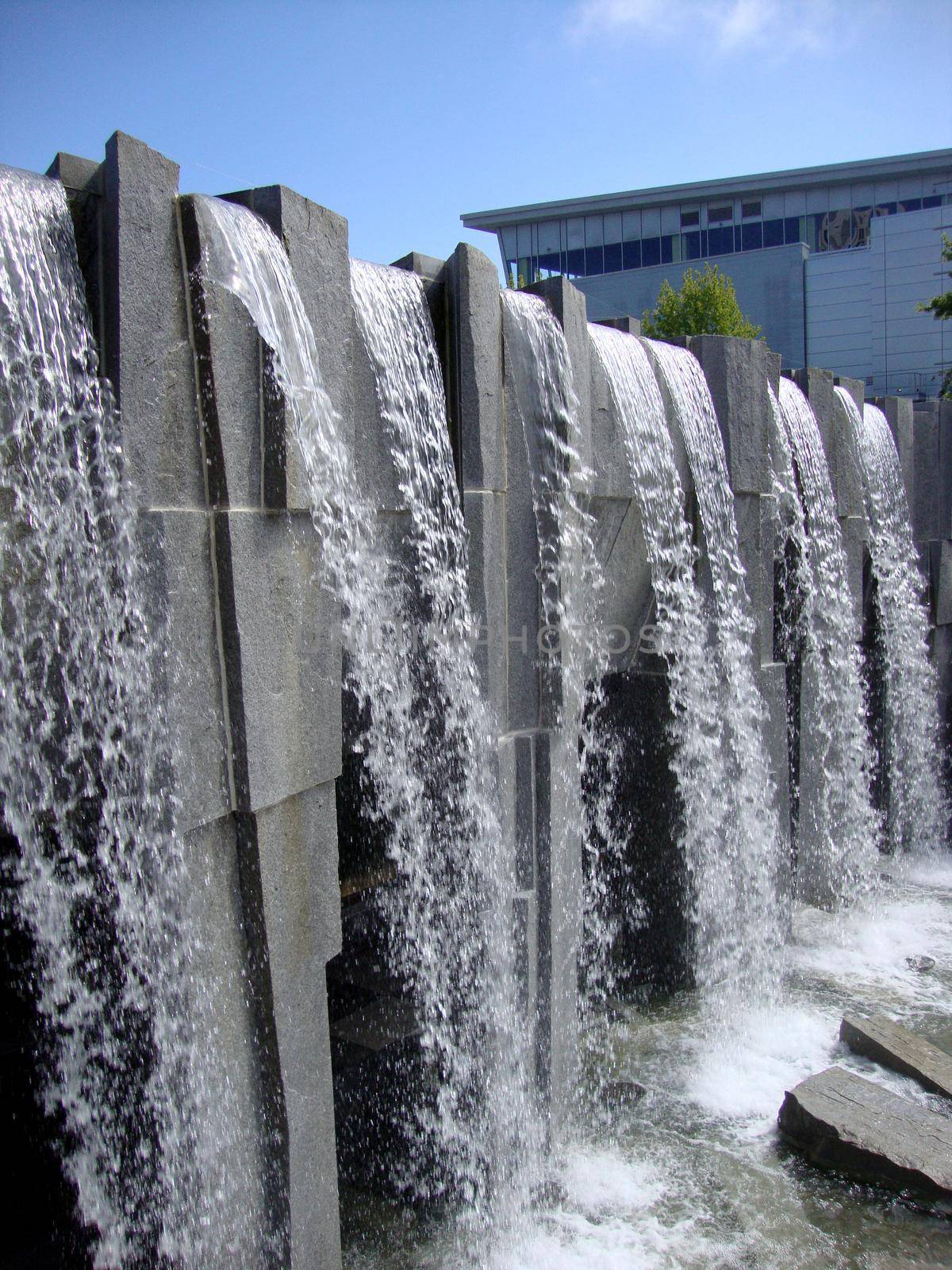 San Francisco - July 11, 2010:  Waterfall at Martin Luther King, Jr. Memorial at Yerba Buena Gardens.  The vision of peace and international unity is enshrined in this memorial featuring a majestic waterfall and shimmering glass panels inscribed with Dr. King’s inspiring words, poems and images from the civil rights movement. Artist and sculptor, Houston Conwill, created this memorial in collaboration with poet Estella Conwill Majoza and architect Joseph De Pace.