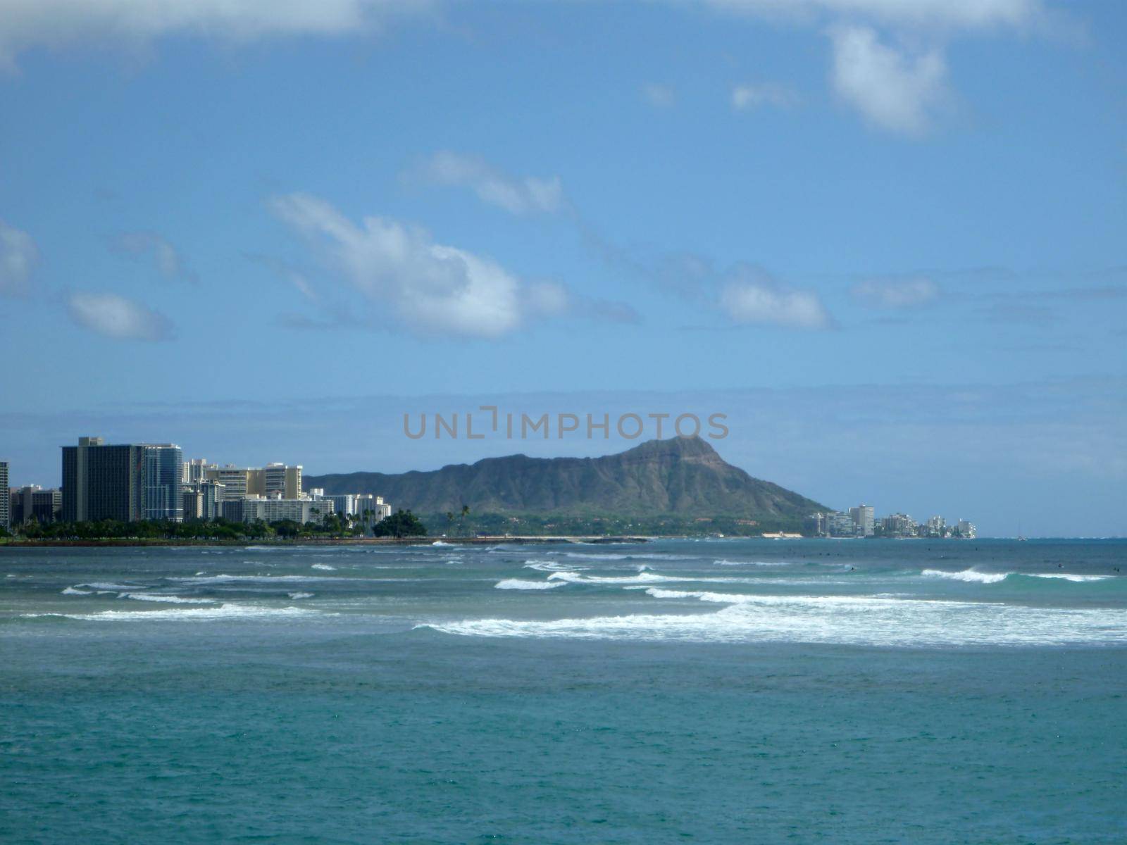 Ala Moana surf and Diamondhead during the day with hotels and Condos along the shore by EricGBVD